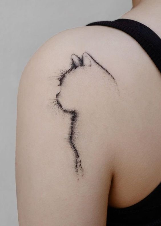 Minimal tattoo of a black cat design back